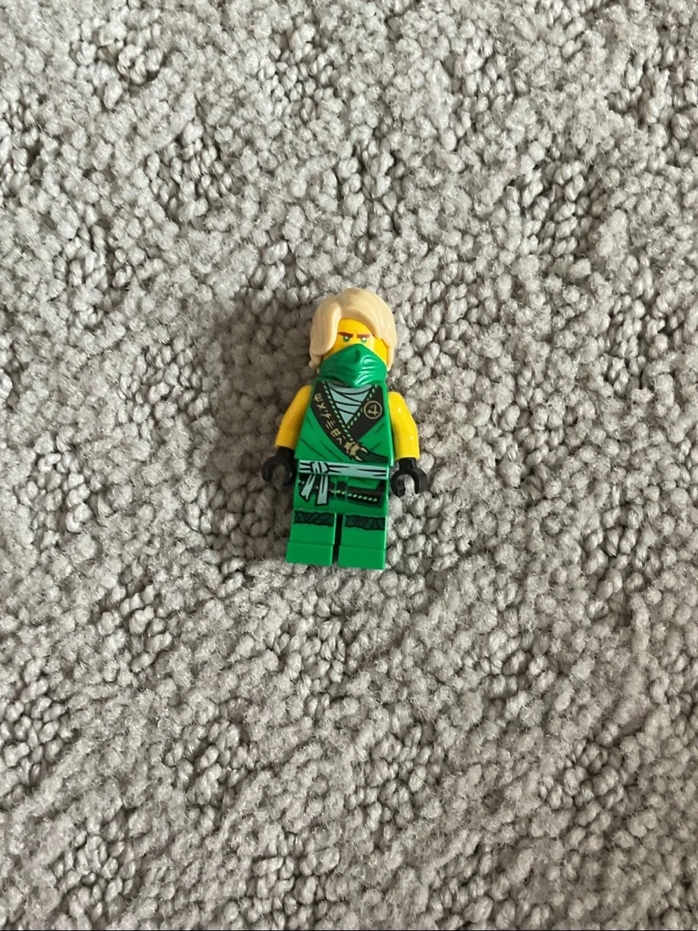 Lego black and orange jet fighter with green accents and minifigures